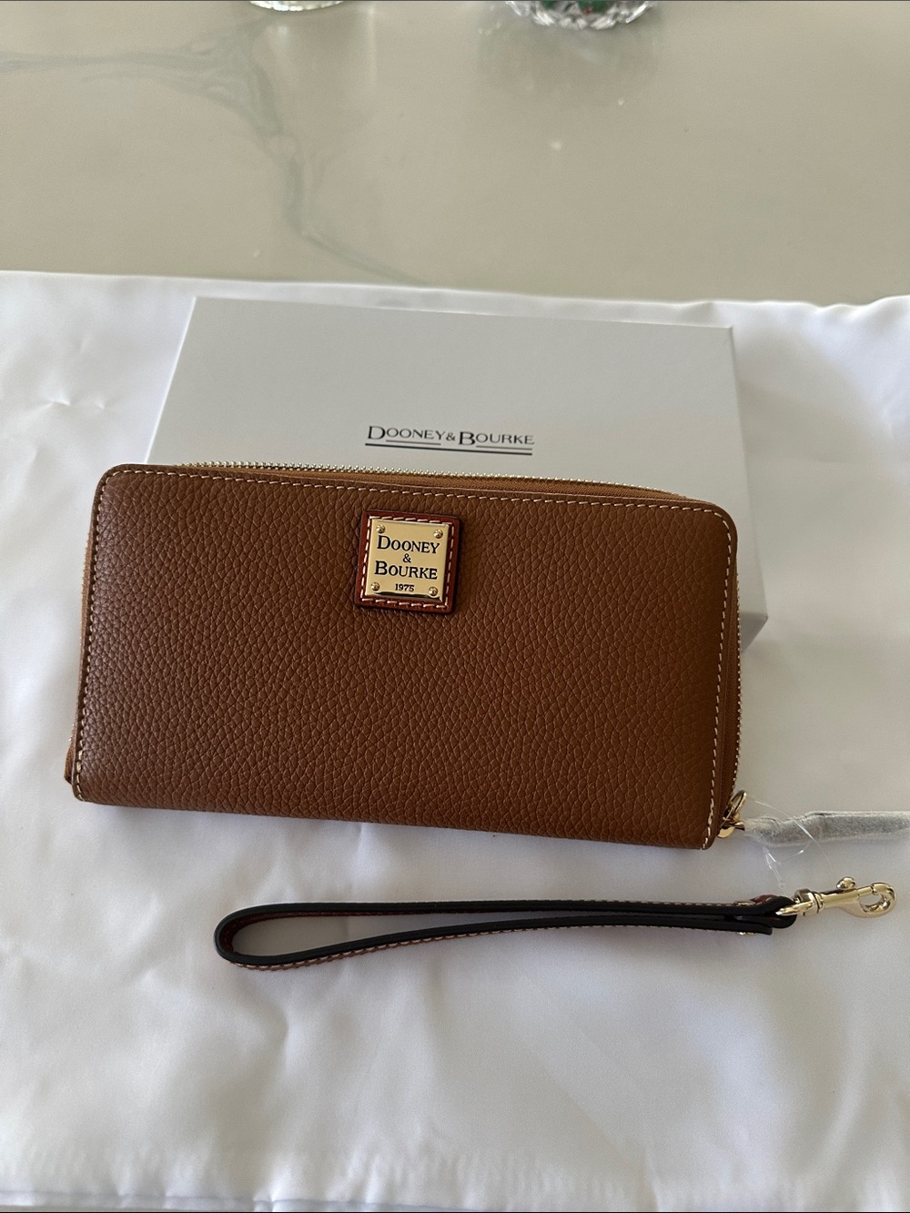 Dooney & Bourke Brown Pebbled Leather Zip Wristlet with Gold Plaque
